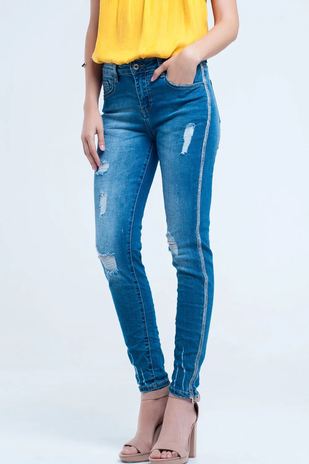 Skinny jeans with rips and glitter