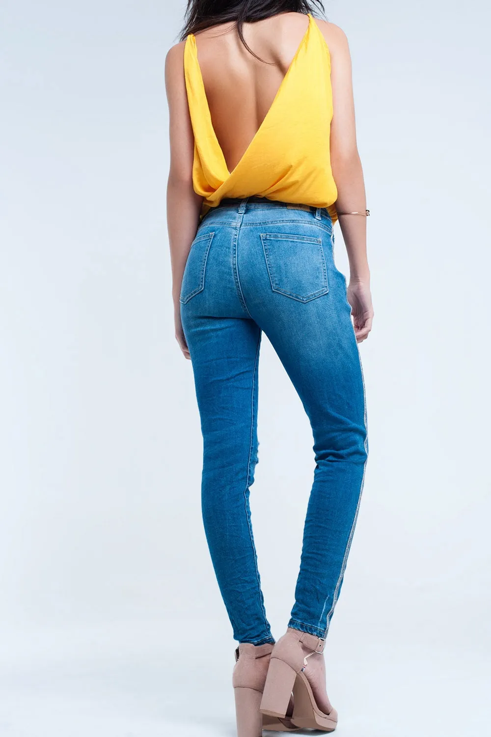 Skinny jeans with rips and glitter