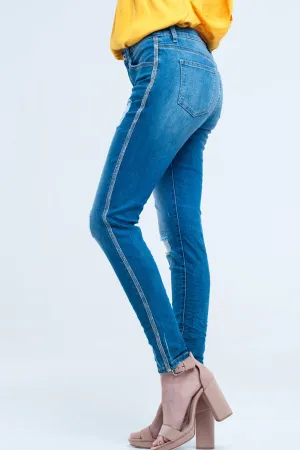 Skinny jeans with rips and glitter